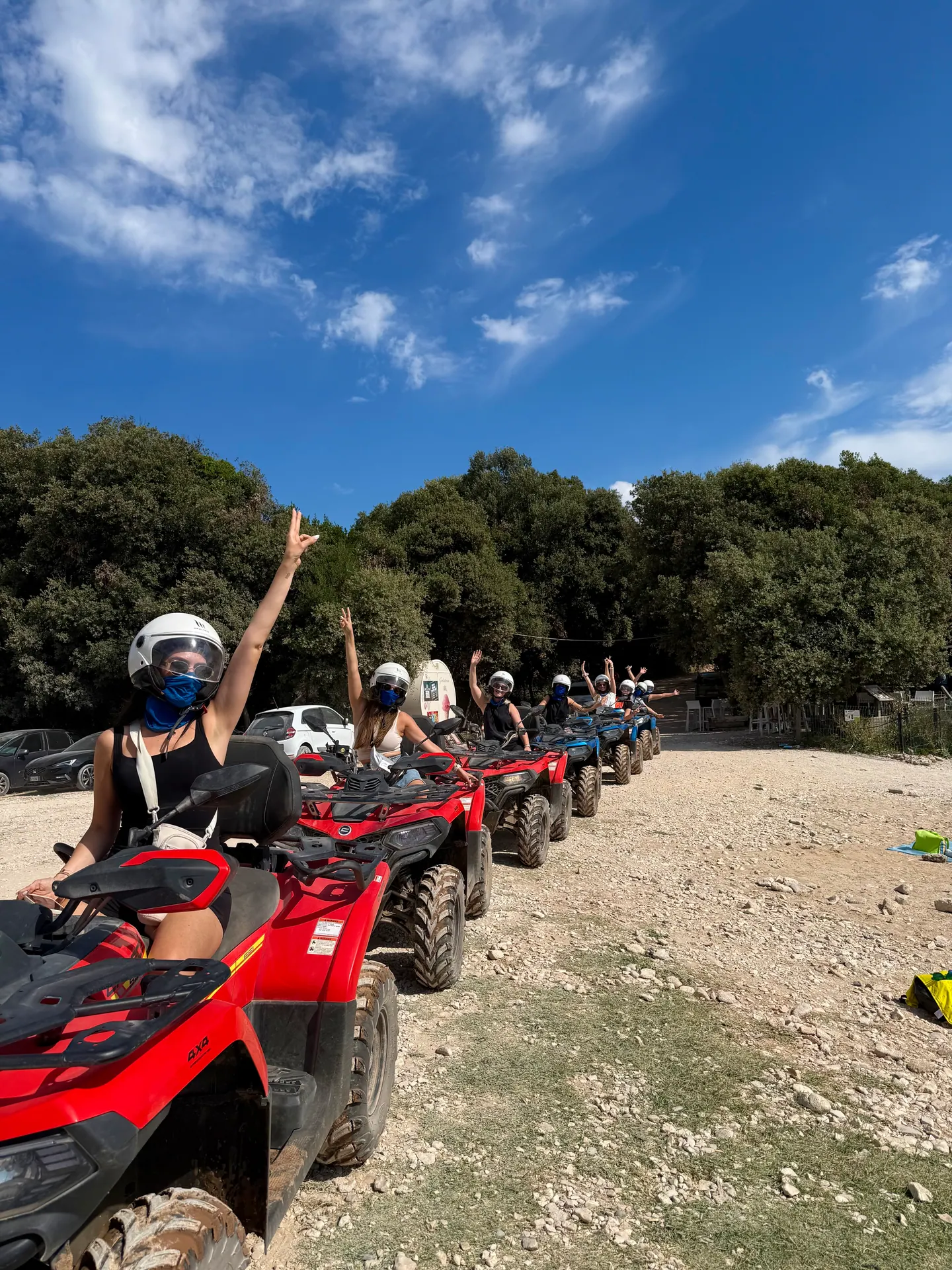 Quad convoy riding beside the rocky coastline
