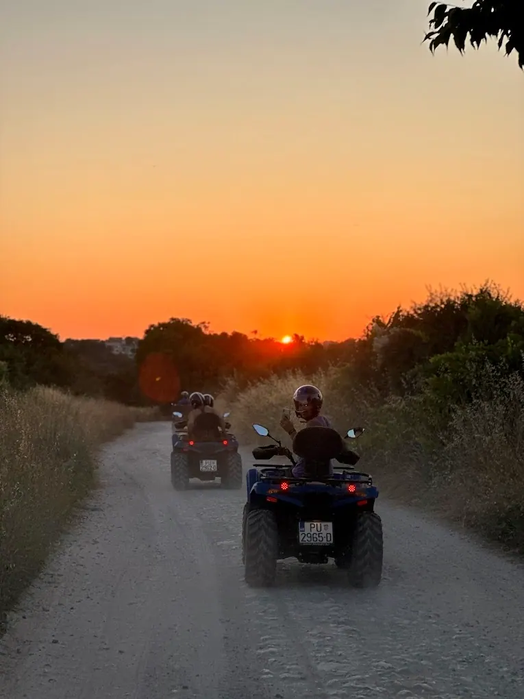 Guided quad safari group riding through southern Istria